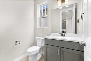 Bathroom with toilet and vanity