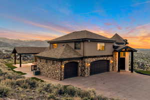 View of front of house featuring a mountain view and central air condition unit