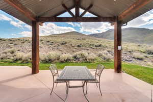 View of patio featuring a mountain view and a gazebo