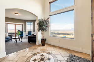 Sitting room featuring light carpet