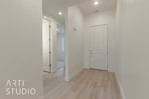 Hall featuring light hardwood / wood-style flooring