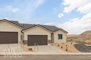 Ranch-style house featuring a mountain view and a garage