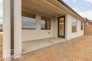 Property entrance with a patio area