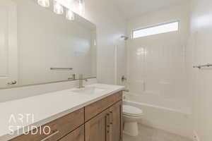 Full bathroom featuring tile patterned flooring, shower / bathing tub combination, vanity, and toilet