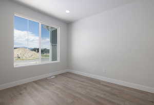 Spare room featuring light wood-type flooring