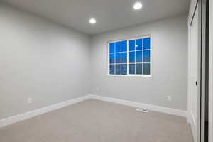 View of carpeted spare room