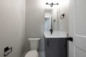 Bathroom with toilet and vanity