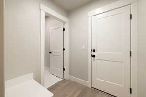 Hallway with light tile flooring