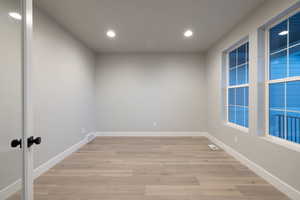 Empty room featuring light wood-type flooring