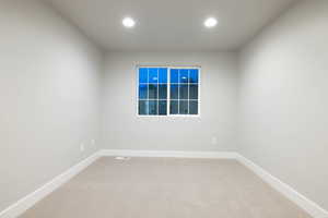 Empty room featuring carpet flooring