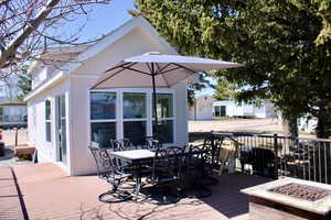 Trex Deck with an outdoor fire pit with beautiful dining set!