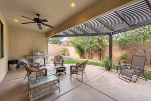 View of patio / terrace featuring area for grilling, a pergola, and ceiling fan