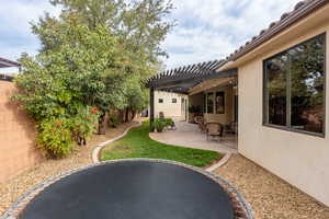 View of yard with a patio area and a pergola