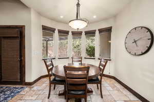 Dining room with light tile floors