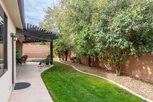 View of yard featuring a patio area and a pergola