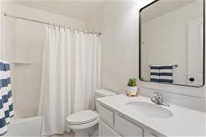 Full bathroom featuring large vanity, shower / bath combination