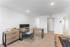 Office with light colored carpet