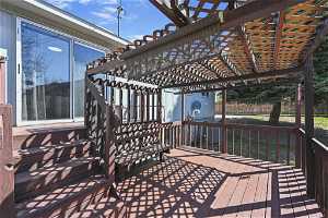 Wooden terrace with a pergola