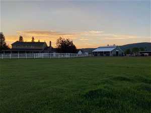 View of one pasture, the barn, and home