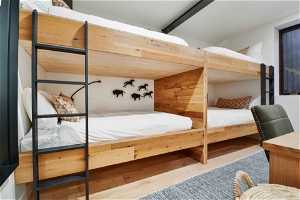 Bedroom with hardwood / wood-style flooring
