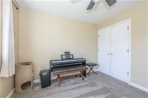 Miscellaneous room with ceiling fan and carpet floors