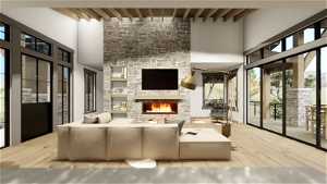 Living room featuring beam ceiling, light hardwood / wood-style floors, and a stone fireplace