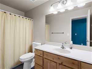Bathroom on Main- featuring vanity, tile floors, and toilet