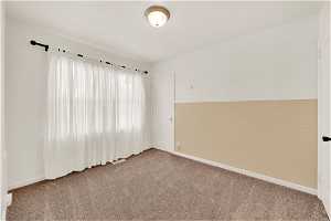 2nd Bedroom with carpet floors and closet