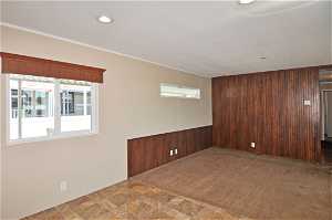 Tiled empty room with wooden walls