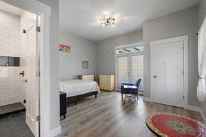 Bedroom featuring w/ french doors to outdoor patio