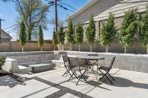 View of patio featuring a fire pit