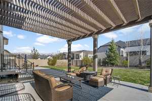 View of terrace with an outdoor living space and a pergola