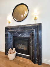 Details featuring a fireplace and hardwood / wood-style floors