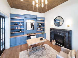 Office space with wood ceiling, hardwood / wood-style flooring, and high vaulted ceiling