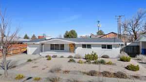 Single story home featuring a garage