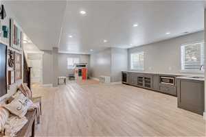 Interior space with light hardwood / wood-style flooring, a wealth of natural light, and sink