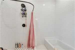 The main floor ensuite bath features a separate tub and shower