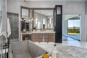 Bathroom featuring vanity with extensive cabinet space, tile flooring, a shower, and a notable chandelier