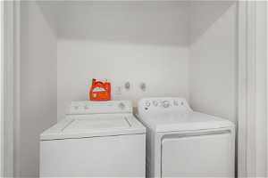 Laundry room featuring washing machine and dryer