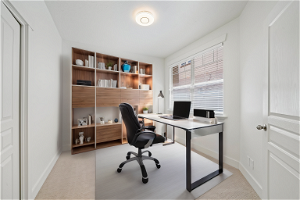 Virtually staged to show space. Bedroom/office.