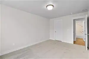 Unfurnished bedroom featuring carpet