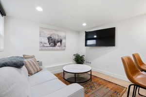 Living room with wood-type flooring