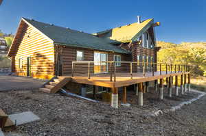 Back of house featuring a deck