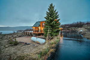 Exterior space with a deck with water view