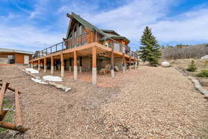 View of side of property with a deck