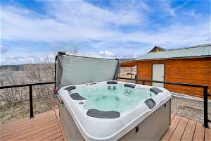 Wooden deck with a hot tub