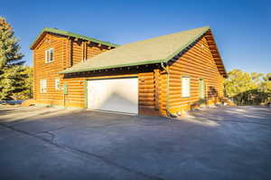 View of side of home featuring a garage