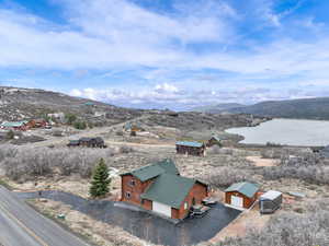 Aerial view featuring a water and mountain view