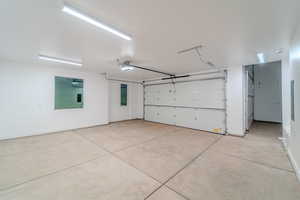 Garage featuring a garage door opener