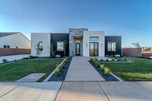 Contemporary home featuring a front yard